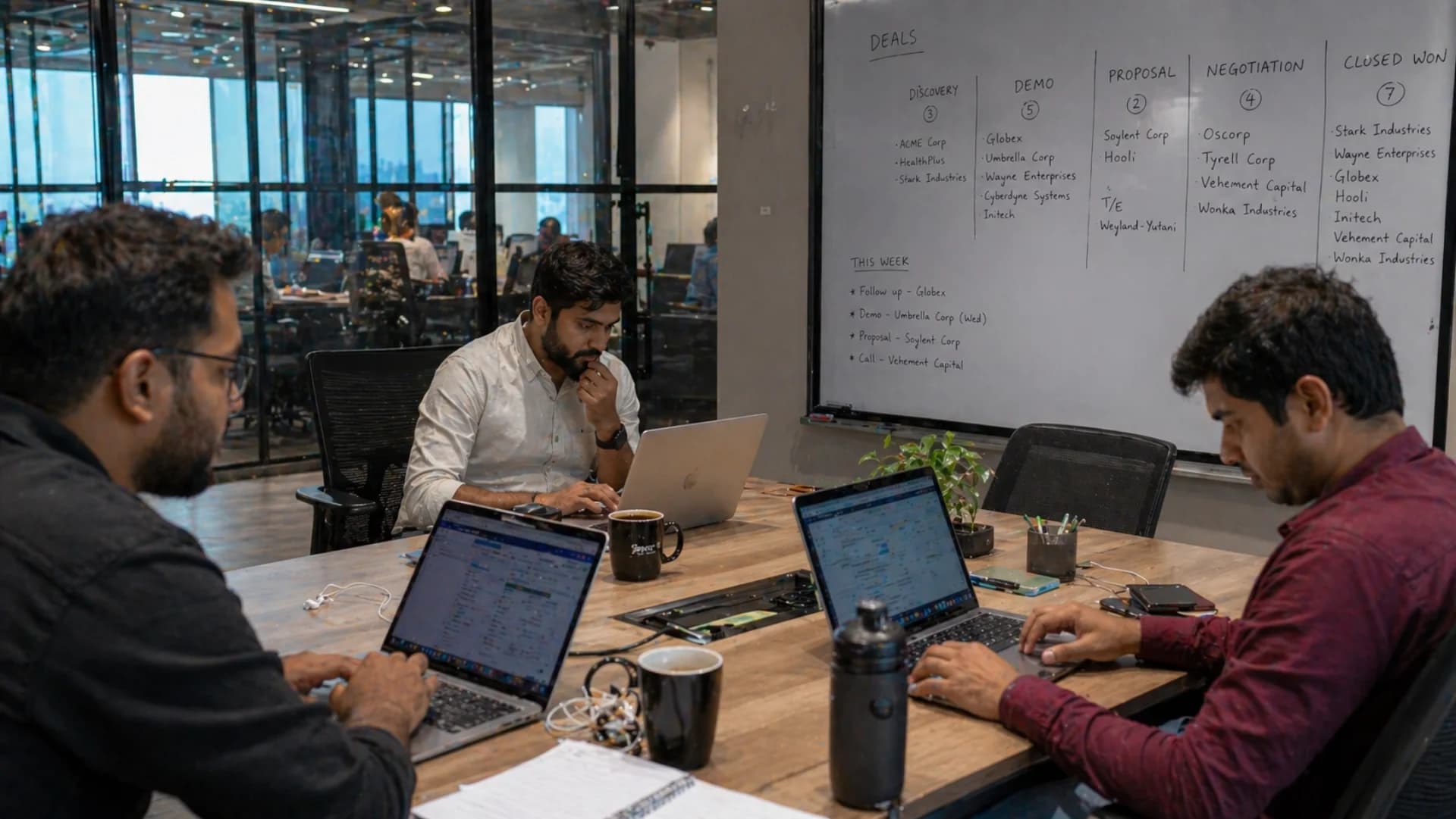 Best CRM software India 2026 — Indian B2B sales team using CRM software on laptops in modern Mumbai office