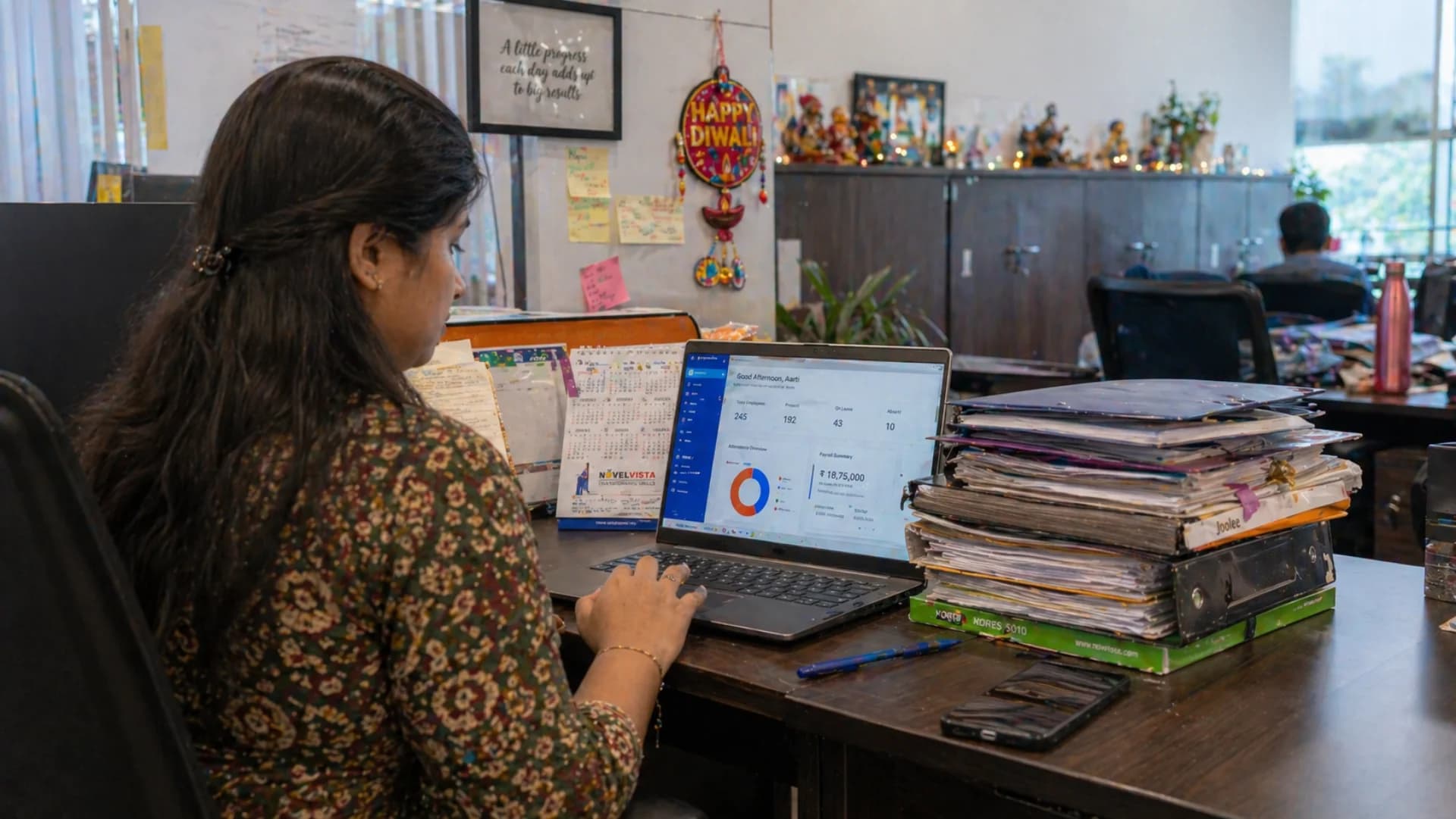 Best HRMS software India 2026 — Indian HR manager reviewing employee attendance and payroll dashboard at Bangalore office