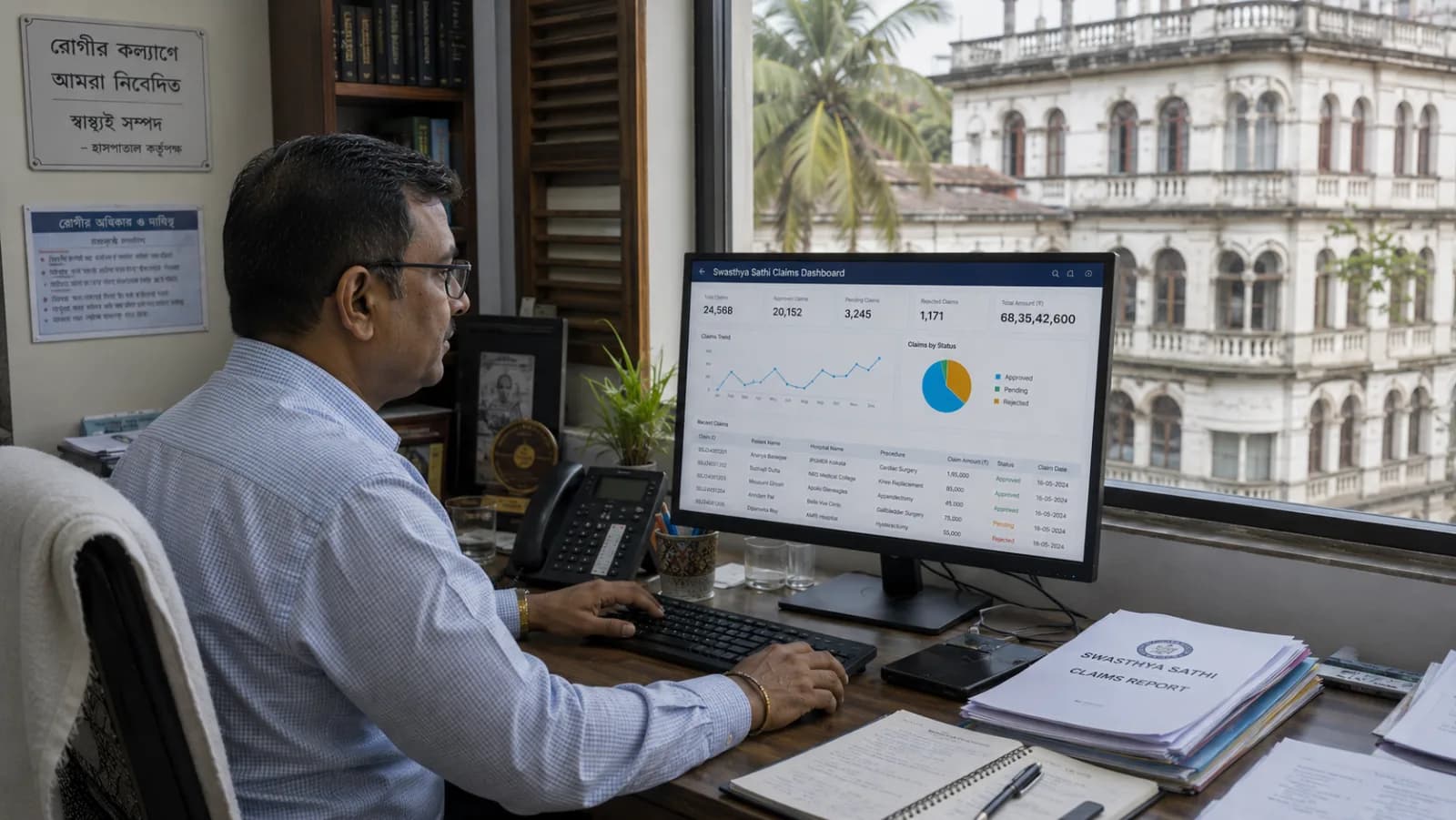 West Bengal hospital administrator reviewing Swasthya Sathi claims and state health portal with ABDM compliance status and Bengali UI visible