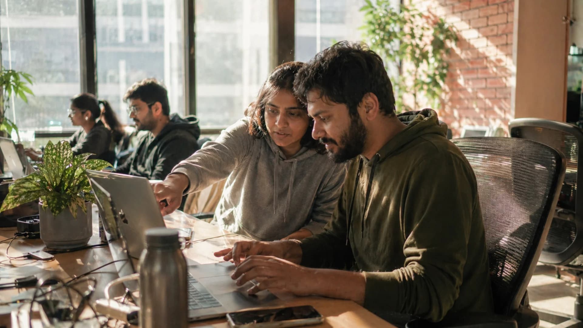 Stripe integration team pair-programming on SaaS subscription billing in a Bangalore startup office — Codingclave developers