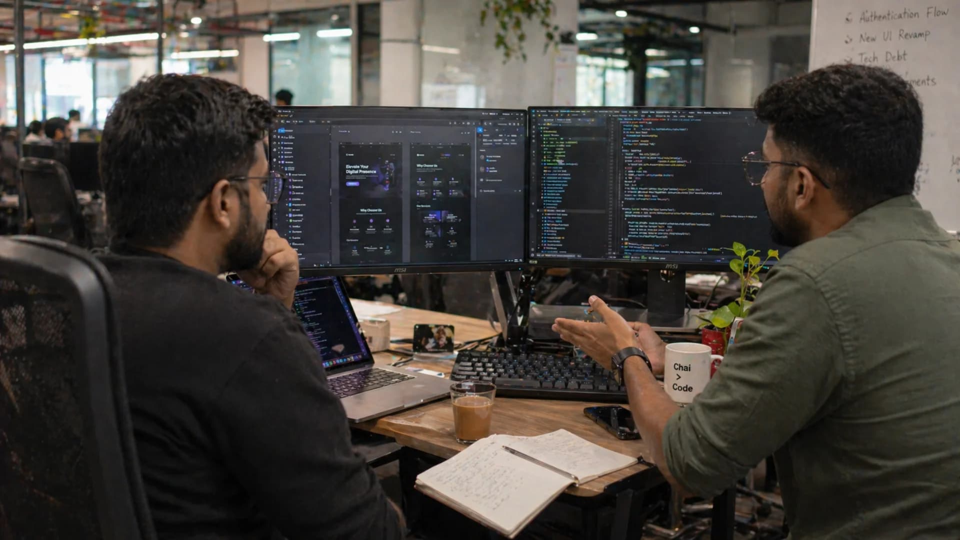 Website development team building responsive React + Next.js website on dual monitors in Bangalore office — Codingclave website development services